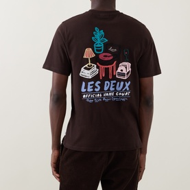 Model wearing Les Deux Record Logo Back Graphic T-Shirt in Mole Brown, showing enlarged colourful Record Player graphic on back with crew neck and