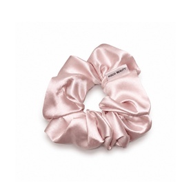 Poco Beauty Summer Glow Edit pink satin scrunchie with gathered fabric and brand label tab.