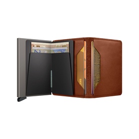 Secrid wallet in saddle tan leather, open to reveal grey aluminium card mechanism and multiple card and note slots