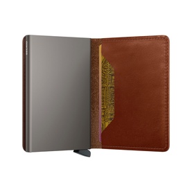 Secrid wallet in saddle tan leather, open to reveal silver card slider mechanism and card slots