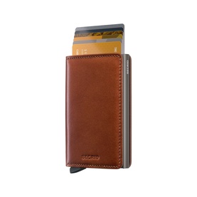 Secrid Wallet in saddle brown leather with silver aluminium card protector, cards visible sliding from top