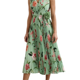 Model wearing green floral pleated midi dress with V-neckline, sleeveless silhouette and belted waist