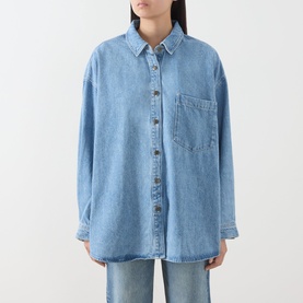 Model wearing American Vintage denim shirt in Authentique Stone, oversized fit, chest pocket, button-front, long sleeves, styled with matching denim