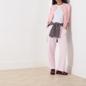 Model wearing American Vintage Petale Vintage cotton sweat bottoms with matching cardigan and striped jumper tied at waist, styled with burgundy