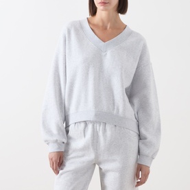 Model wearing American Vintage Sweat Top in Gris Chine, V-neck, relaxed fit, styled with matching grey marl joggers.