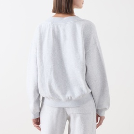 Model wearing AMERICAN VINTAGE Sweat Top in Gris Chine, relaxed fit with dropped shoulders, styled with matching joggers, back view.