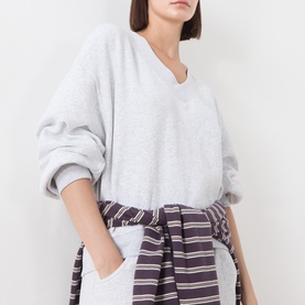 Model wearing American Vintage Sweat Top in Gris Chine, V-neck relaxed fit, styled with striped shirt tied at waist