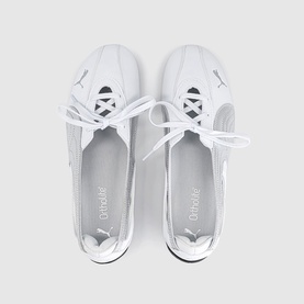 Puma white and silver lace-up trainers, overhead flat lay view showing both shoes with white soles and tonal branding