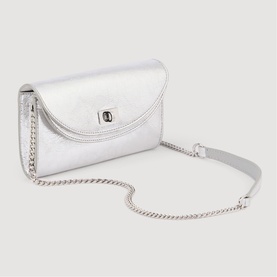 Sandro crossbody bag in silver metallic leather with envelope flap, twist-lock closure, and silver chain strap