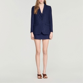 Model wearing Sandro Womens French Dress in dark navy pinstripe, styled with matching blazer and brown heeled mules.