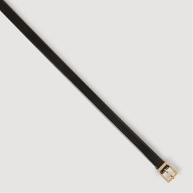 Slim black leather belt with gold-tone rectangular buckle, angled flat lay on white background