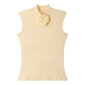 Cream sleeveless ribbed knit top with high neck, lettuce-edge trim, and corsage floral detail at neckline