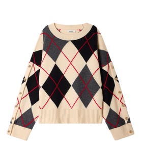 Sandro ecru and black argyle knit sweater with red diamond outlines, crew neck, long sleeves, and gold button cuff detail