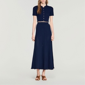 Model wearing Sandro Womens French Dress in navy blue, short-sleeve cropped top and midi skirt co-ord with contrast trim detail.