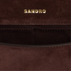 Sandro brown suede bag interior detail showing card slots and gold-tone embossed logo
