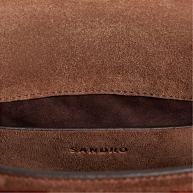 Sandro Le Mambo Suede Shoulder Bag in brown, interior view showing dark polyester lining and embossed brand logo
