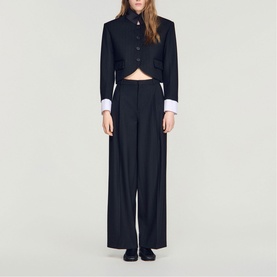 Model wearing Sandro Womens French Dress in black, styled with matching wide-leg trousers, cropped blazer with white cuff detail and button front.