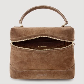 Sandro brown suede top-handle bag, open to show burgundy interior, gold-tone zip and hardware detail