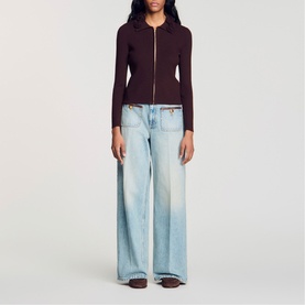 Model wearing Sandro brown zip-through ribbed cardigan with wide-leg light wash jeans