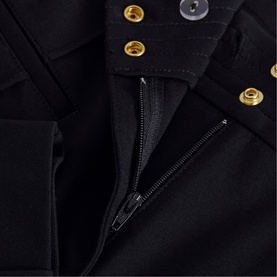 Phase Eight black dress close-up showing gold snap buttons at neckline and black zip fastening detail