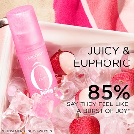 Lanc&ocirc;me O Oui Juicy body mist in pink bottle, displayed on ice with lychee fruits, with "Juicy & Euphoric" text overlay
