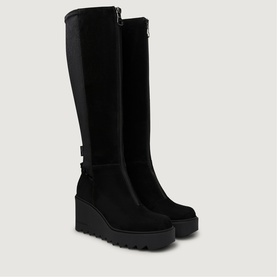 Black suede and stretch panel knee-high wedge boots with buckle detail, back zip fastening, and chunky cleated sole