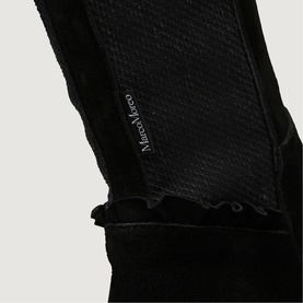 Marco Marco black gloves close-up showing textured and suede panels with branded logo detail and ruffled trim edge.