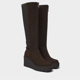 Marco Moreo brown suede knee-high wedge boots with buckle detail, chunky lug sole, and back zip fastening
