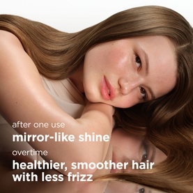 Maria Nila hair mask lifestyle shot showing model with glossy, smooth long brown hair, with text highlighting mirror-like shine and frizz reduction