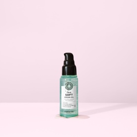 Maria Nila Soft Argan Oil hair oil in a mint green pump bottle with black cap, small travel size