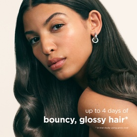 Model with long, glossy dark hair showcasing Maria Nila smoothing treatment results, with "up to 4 days of bouncy, glossy hair" text overlay.
