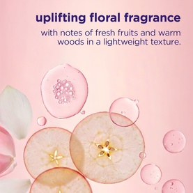 Maria Nila treatment fragrance infographic showing floral and fruit notes, with apple slices, petals, and gel droplets on pink background