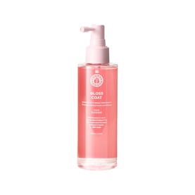 Maria Nila Gloss Coat treatment in pink pump bottle, smoothing and frizz-reducing hair treatment