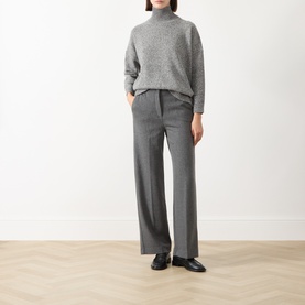 Model wearing Max Mara Weekend Dorata Straight-Leg Trousers in light grey, styled with a grey roll-neck jumper and black loafers