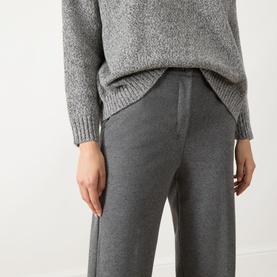 Model wearing Max Mara Weekend Dorata Straight-Leg Trousers in light grey, styled with a grey marl knit sweater