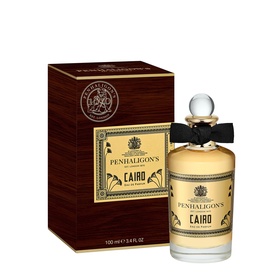 Penhaligon's Cairo Eau de Parfum 100ml bottle with black bow stopper beside its dark red and gold gift box.