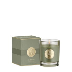 Penhaligon Halfeti candle in sage green glass with gold crest emblem, shown alongside matching gift box