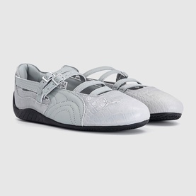 Puma white croc mary jane flats with double buckle straps, quilted toe detail, and black rubber sole