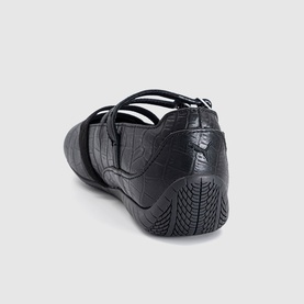 Puma black croc-embossed flat shoe with multi-strap upper, rear three-quarter view showing textured detail and black sole.