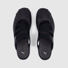 Puma black flat sandals with triple cross-strap upper and cushioned footbed, overhead view showing both shoes