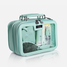 The Smooth Company Smoothcase&trade; Travel Set in mint green, clear-front structured case with handle, containing haircare products and brush