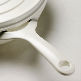 Tramontina Saute Pan in latte, close-up of ceramic handle and stacked lid detail