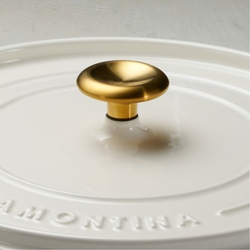 Tramontina Saute Pan in latte with embossed logo lid and gold-tone knob, close-up detail shot