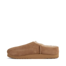 Emu camel suede slip-on slippers with cream shearling lining and tan rubber sole, side profile view.