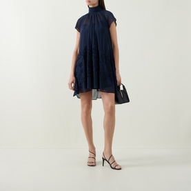 Model wearing Jonathan Simkhai Aviel Floral Appliqu&eacute; Mini Dress in Midnight, featuring gathered high neck, cap sleeves and draped chiffon silhouette,