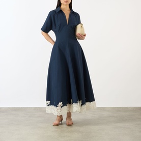 Model wearing Jonathan Simkhai Nerris Contrast Lace Dress in Midnight Multi, midi length with pointed collar and contrast lace hem, styled with a