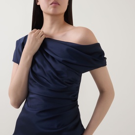 Model wearing Jonathan Simkhai Midnight navy off-shoulder draped acetate top with ruched bodice detail