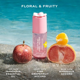 Marc Jacobs Daisy Mist Mandarin Fizz Hair and Body Mist with mandarin, pink grapefruit, and maracuja notes displayed poolside