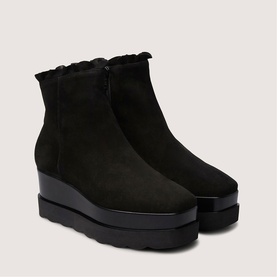 Marco Moreo black suede ankle boots with ruffle trim collar, side zip, and chunky black platform wedge sole