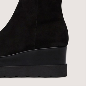 Marco Moreo black suede wedge boot close-up showing platform sole and sleek heel detail